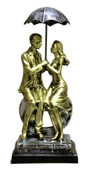 Love Couple Sitting on Heart Carrying Umbrella Figurine (Golden, Height 11 in X Length 5 in)